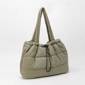 Quilted khaki puffer tote bag with puffy square stitching and adjustable drawstring
