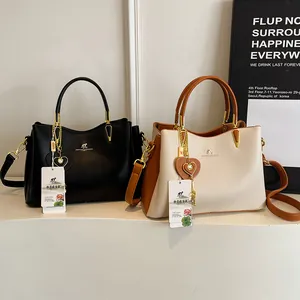 Elegant high-capacity soft leather handbag for women in black and beige two-tone options
