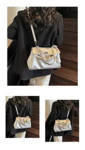 Detailed view of silver metallic bag with twist lock closure and smooth glossy finish
