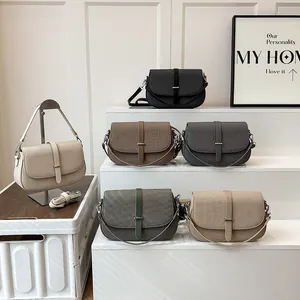 Minimalist crossbody shoulder bag in five solid colors with metal strap buckle detail