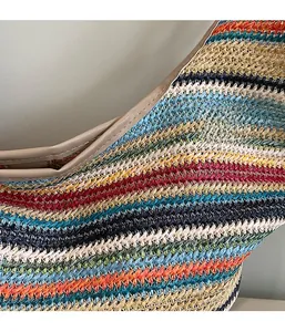 Detailed macro view of multi-color woven straw texture and premium edge stitching