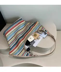Interior view showing the large capacity and storage space of the woven striped tote bag