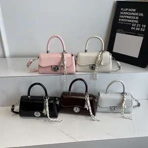 Retro small square handbags in five colors with twisted metal locks and tassel charms
