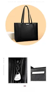 Détail de la texture cuir grainé et de la fermeture éclair argentée du sac cabas