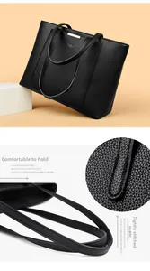 Gros plan sur la texture du cuir grainé et les coutures d'un grand sac cabas noir