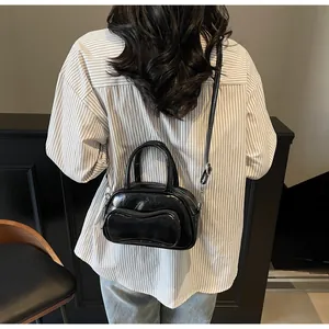 Detailed back view of a black bowling bag showing size ratio on model and glossy texture