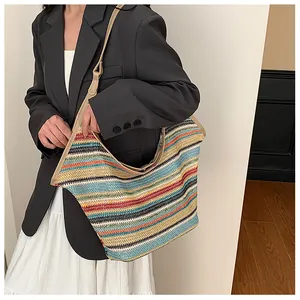 Detail of colorful striped woven tote bag with premium leather shoulder straps