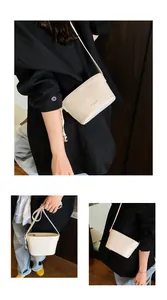 Détail du sac seau en cuir crème avec cordon de serrage à boule métallique chic
