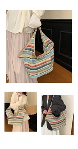 Detail of colorful striped woven tote bag with brown shoulder strap and large capacity