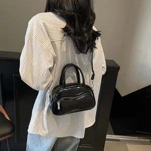Glossy black patent leather bowling bag with silver hardware for women summer fashion