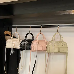 Vintage waxed leather bowling bags in four colors with decorative lace bows and crossbody straps