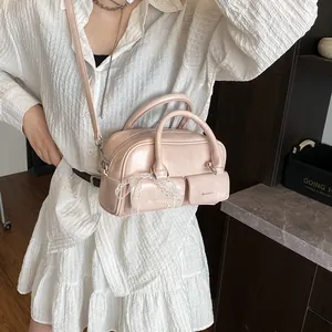 Pink faux leather bowling bag with twin pockets and lace ribbon detail for women