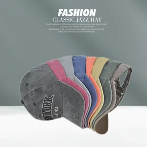 Detail of vintage washed canvas baseball caps in eight colors with New York embroidery