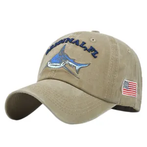 Macro detail of khaki washed cotton baseball cap with shark embroidery and US flag patch