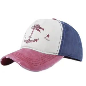 Detail of distressed brim and anchor print on a vintage-style patchwork baseball cap