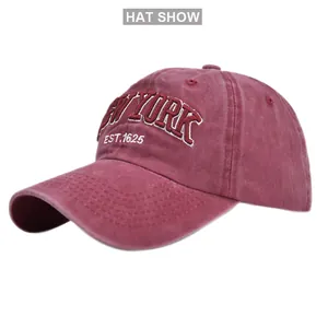 Close-up of vintage red washed cotton baseball cap with 3D New York embroidery