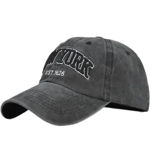 Detail of vintage charcoal grey cotton baseball cap with white New York embroidery