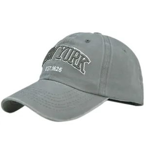 Detailed view of gray New York embroidery on vintage washed cotton baseball cap