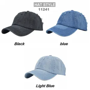 Detailed view of distressed denim texture and frayed edges on baseball caps