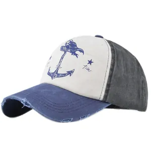 Close-up of distressed cotton canvas baseball cap with anchor print and worn edges