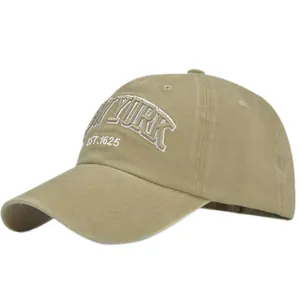 Close-up of khaki cotton baseball cap with white 3D New York EST.1625 embroidery