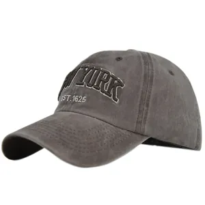 Detail of vintage gray washed cotton baseball cap with New York 3D embroidery textures