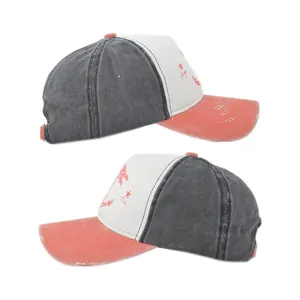 Close-up of distressed vintage baseball cap with anchor print and torn brim detail