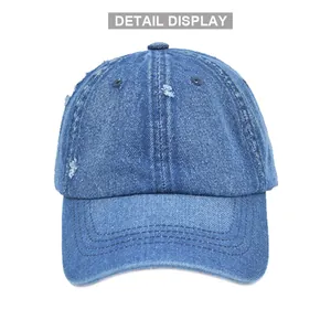 Vintage distressed denim baseball cap with washed blue fabric and ripped details