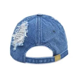 Vintage distressed blue denim docker cap with ripped details and metal buckle adjustment