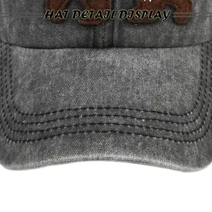 Vue détaillée de la casquette en coton avec broderie ours et coutures de visière