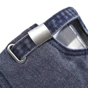 Close-up of the metal buckle and denim texture on the back of the US flag baseball cap