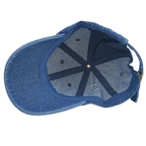 Internal view of a washed denim baseball cap with reinforced seams and adjustable buckle