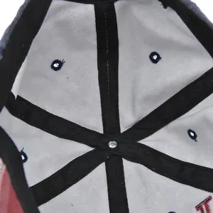 Detail of baseball cap interior with reinforced stitching and breathable eyelets