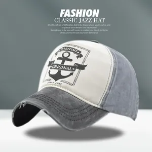 Close-up of maritime anchor print and distressed torn details on vintage baseball cap