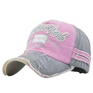Detailed close-up of distressed cotton baseball cap with 1969 3D embroidery and frayed edges