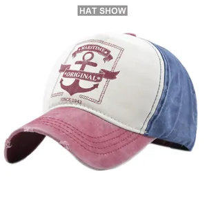 Detail showing the distressed brim and maritime anchor print on the vintage baseball cap