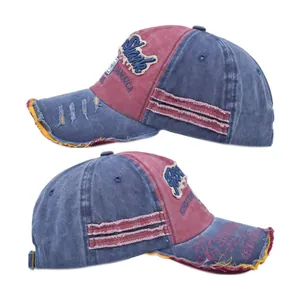 Macro detail of distressed washed denim baseball cap with vintage embroidery and worn edges