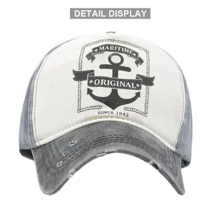 Detailed view of the vintage maritime anchor print and distressed brim on the baseball cap