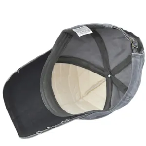 Detail view of cotton vintage baseball cap inner lining and metal adjustment buckle