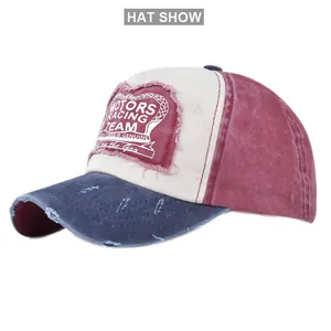 Detail of vintage distressed baseball cap featuring motors racing team patchwork and embroidery
