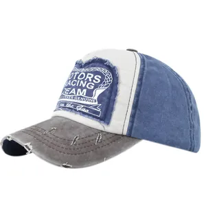 Detail of vintage distressed baseball cap with Motors Racing Team patch and frayed brim