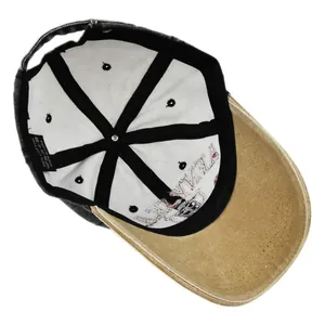 Detail of baseball cap interior showing 100% cotton material and reinforced seam tape