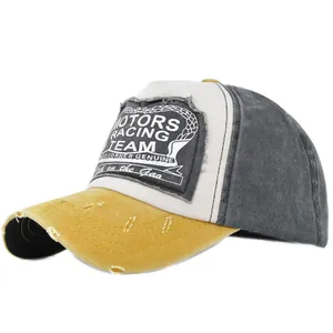 Detail of vintage racing cap with motors patch, distressed yellow brim and tricolor design