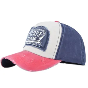 Detailed view of vintage distressed baseball cap with motors racing patch and ripped fabric