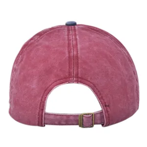 Detail view of retro red washed cotton baseball cap with adjustable metal back strap