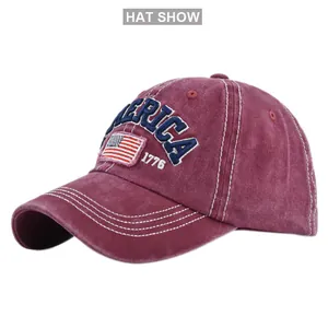 Detail of burgundy vintage washed cotton cap with 1776 embroidery and America patch