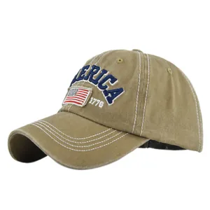 Close-up of AMERICA 1776 embroidery and American flag patch on washed khaki baseball cap