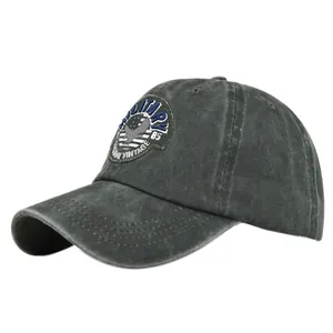 Detailed close-up of MILITARY eagle embroidery on vintage washed cotton baseball cap
