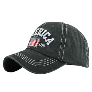 Detailed close-up of white 1776 AMERICA embroidery on a vintage charcoal baseball cap