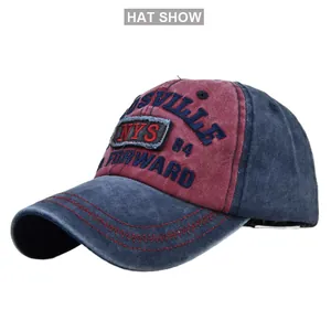 Detail of red and blue vintage baseball cap with 3D embroidery and denim texture